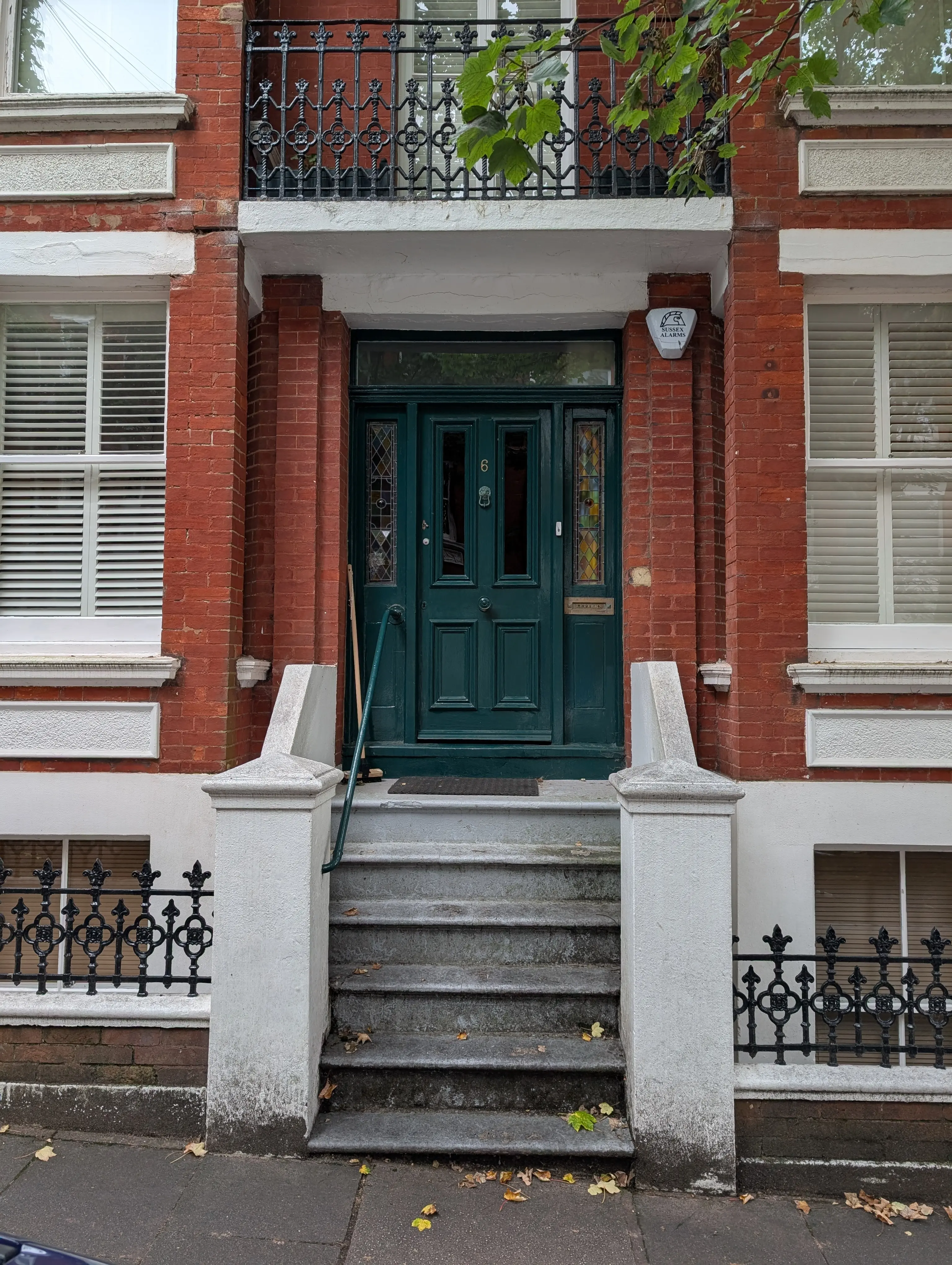 green door with colourful glasswork