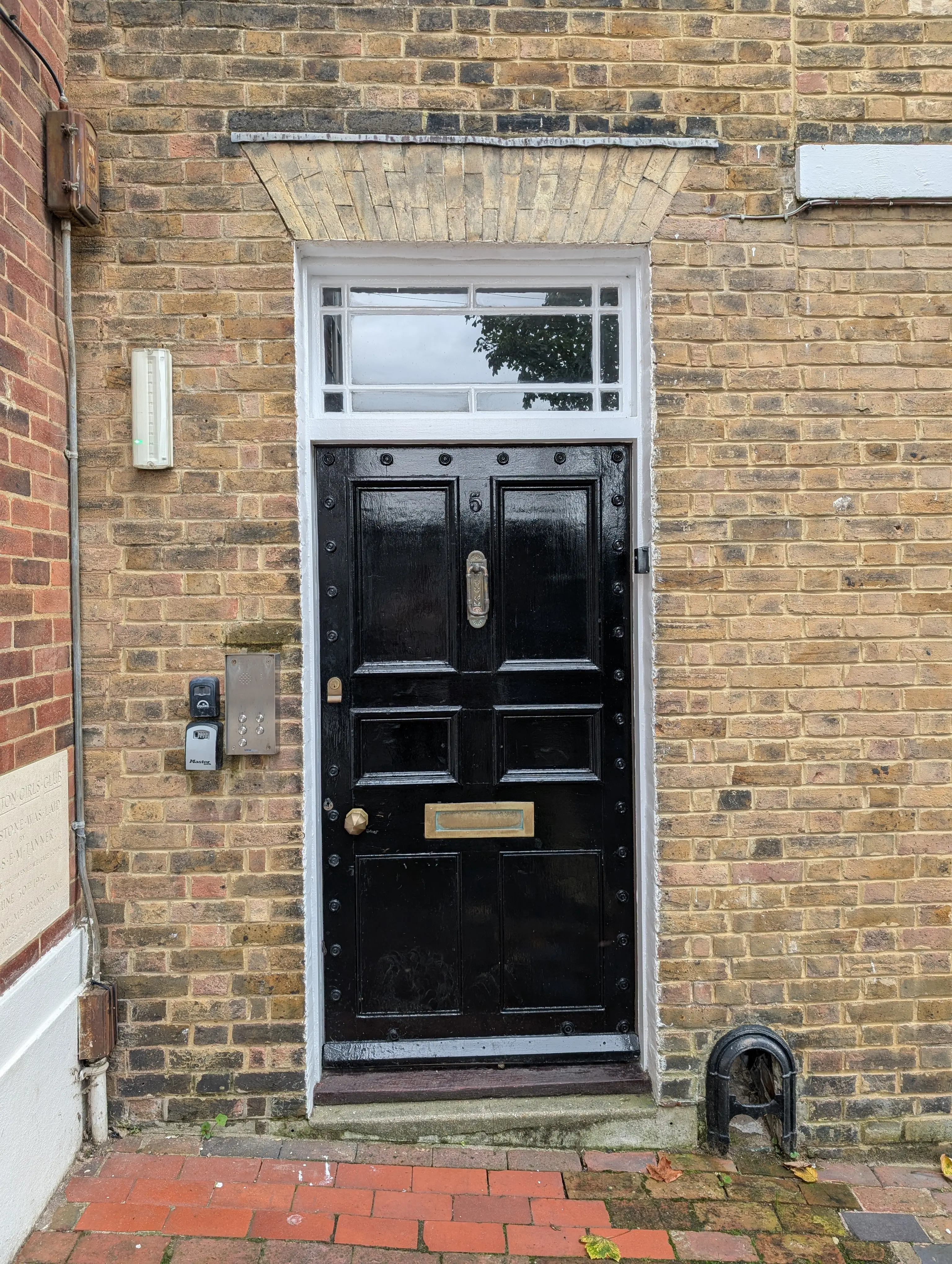 ornate black door with stylish rivets on border