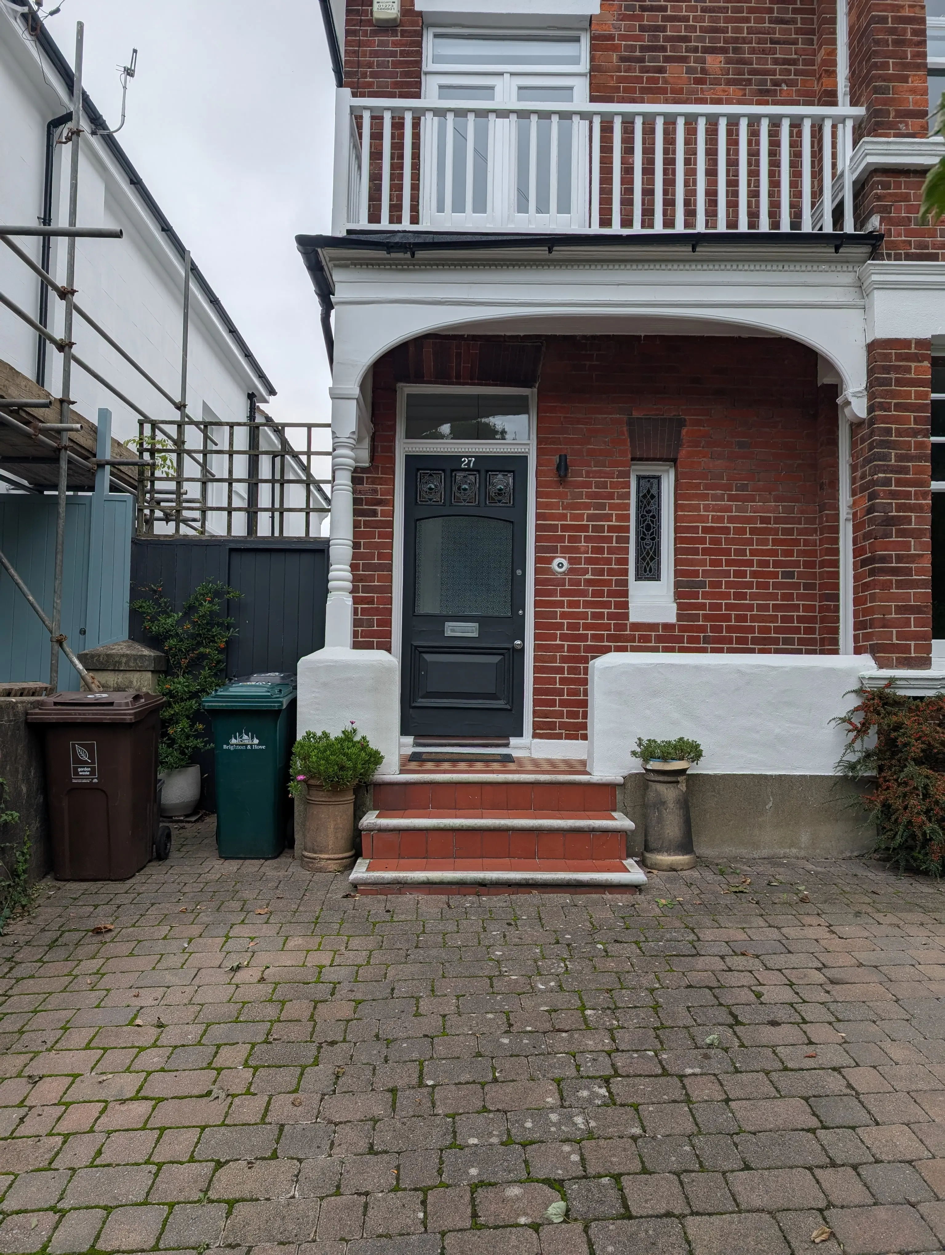 black door on red brick building colourful glass windows